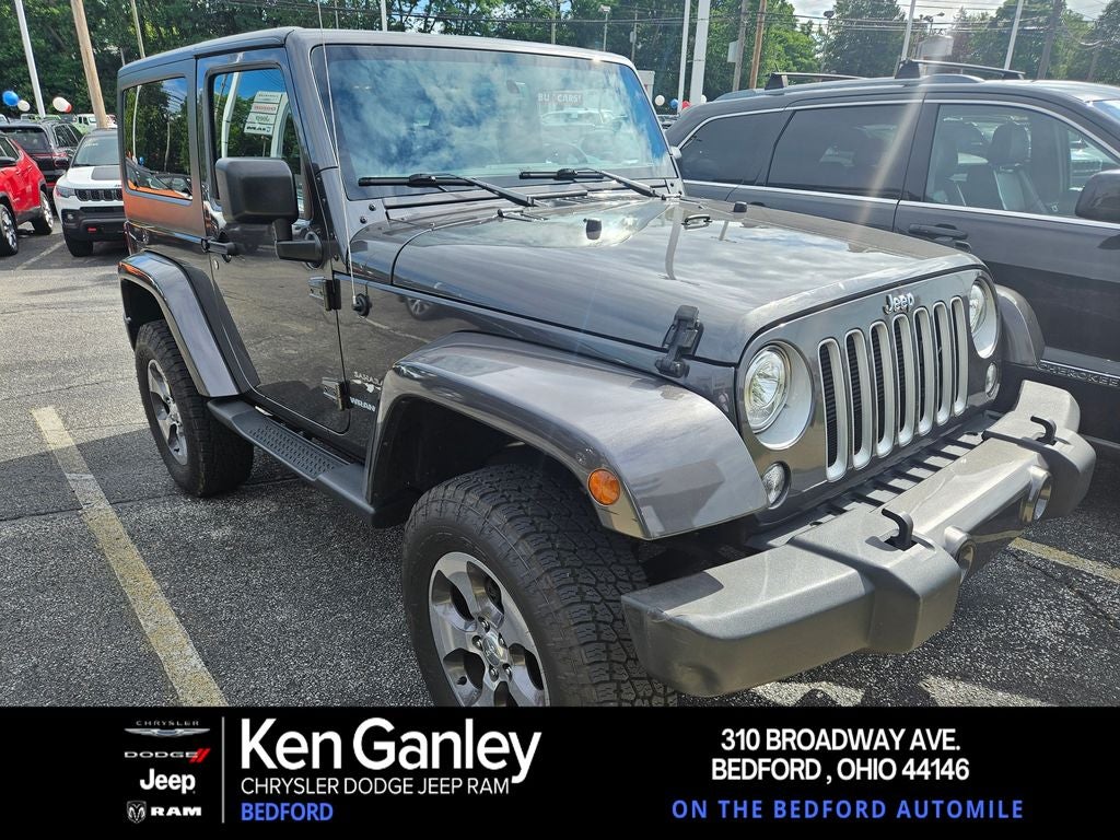 2017 Jeep Wrangler Sahara in Granite Crystal Metallic Clearcoat — front three-quarter view