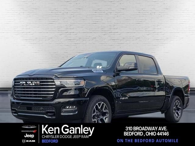2026 RAM Ram 1500 RAM 1500 LARAMIE CREW CAB 4X4 5'7' BOX in Diamond Black Crystal Pearl-Coat Exterior Paint — front three-quarter view