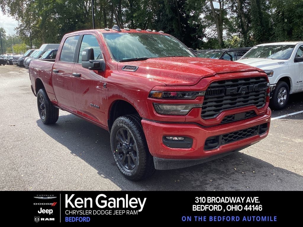 2026 RAM Ram 3500 RAM 3500 BIG HORN CREW CAB 4X4 6'4' BOX in Molten Red Pearl-Coat Exterior Paint — front three-quarter view