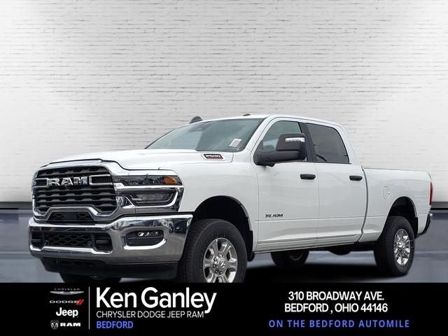 2026 RAM Ram 2500 RAM 2500 BIG HORN CREW CAB 4X4 6'4' BOX in Bright White Clear-Coat Exterior Paint — front three-quarter view