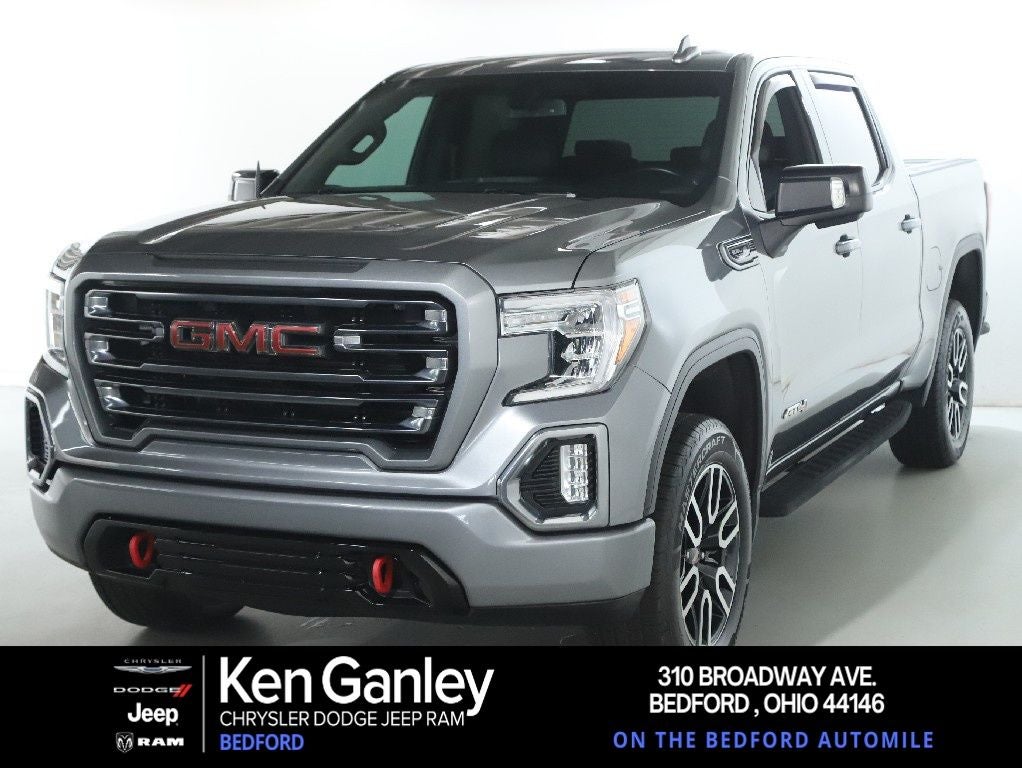 2021 GMC Sierra 1500 4WD Crew Cab Short Box AT4 in Steel Metallic — front three-quarter view